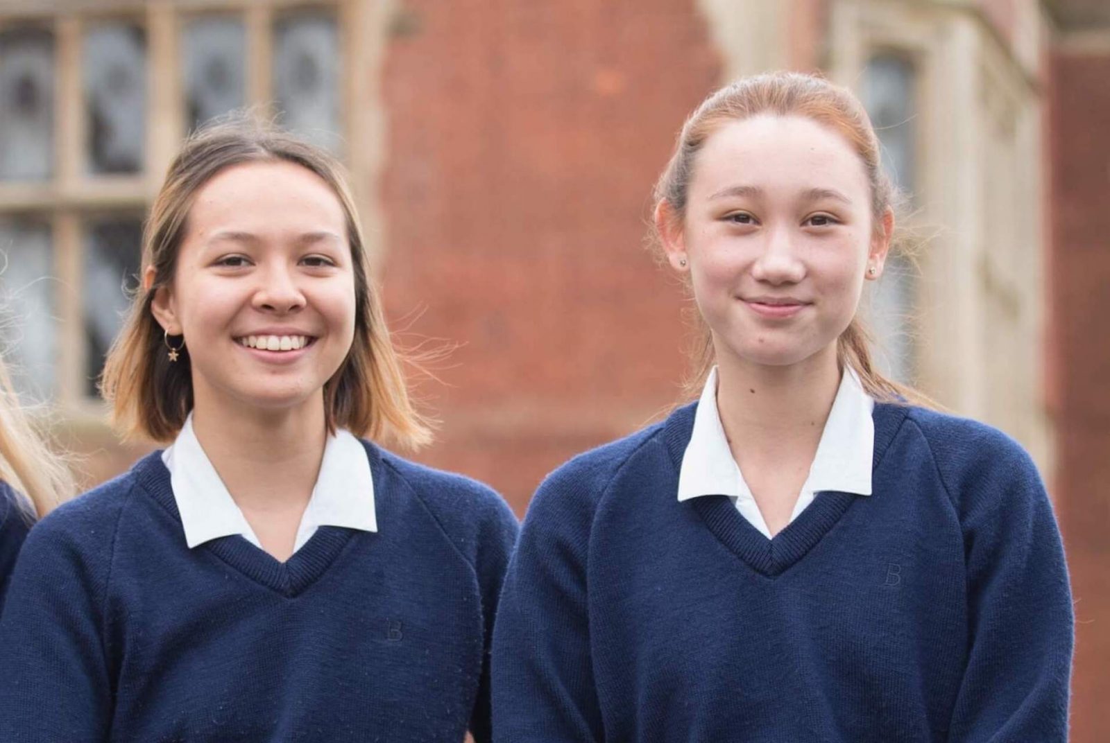 two girls in school uniforms